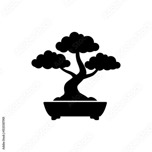 Bonsai tree artfully shaped in shallow pot showcasing miniature landscape