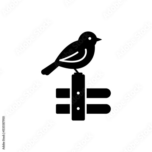 Bird perched calmly on wooden fence post in natural outdoor setting