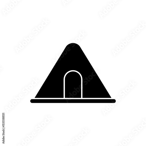 Tomb with pyramid shape and small entrance carved into stone structure