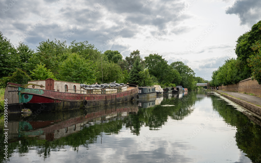 Hanwell, Greater London, UK: Old boats on the Grand Union Canal near Hanwell in London. Hanwell, Greater London, UK: Old boats on the Grand Union Canal near Hanwell in London.
