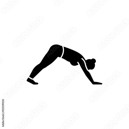 Woman in downward dog yoga pose stretching and strengthening
