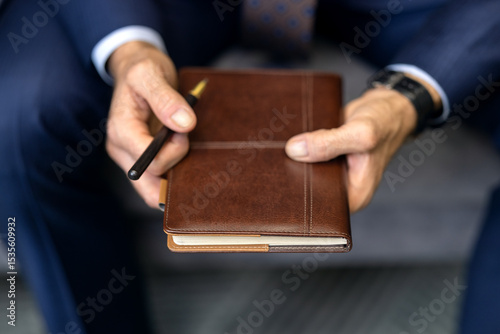 Portrait of handsome successful confident man. Elegant mature businessman. Adult employee business man corporate lawyer, he wear classic formal suit shirt tie work in office with book