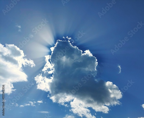 Fototapeta Naklejka Na Ścianę i Meble -  Blue sky and a cloud with rays
