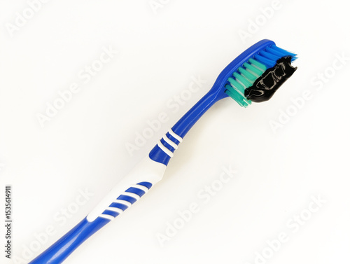 Colorful toothbrush with blue handle and green bristles for effective oral hygiene and daily cleaning routine