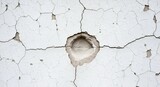 Weathered White Wall Texture with Cracks and Hole Detailing aged surface background