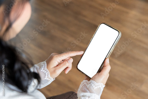 Young woman hands holding cellphone white blank display, empty screen for social media. Cellphone blank white screen mockup
