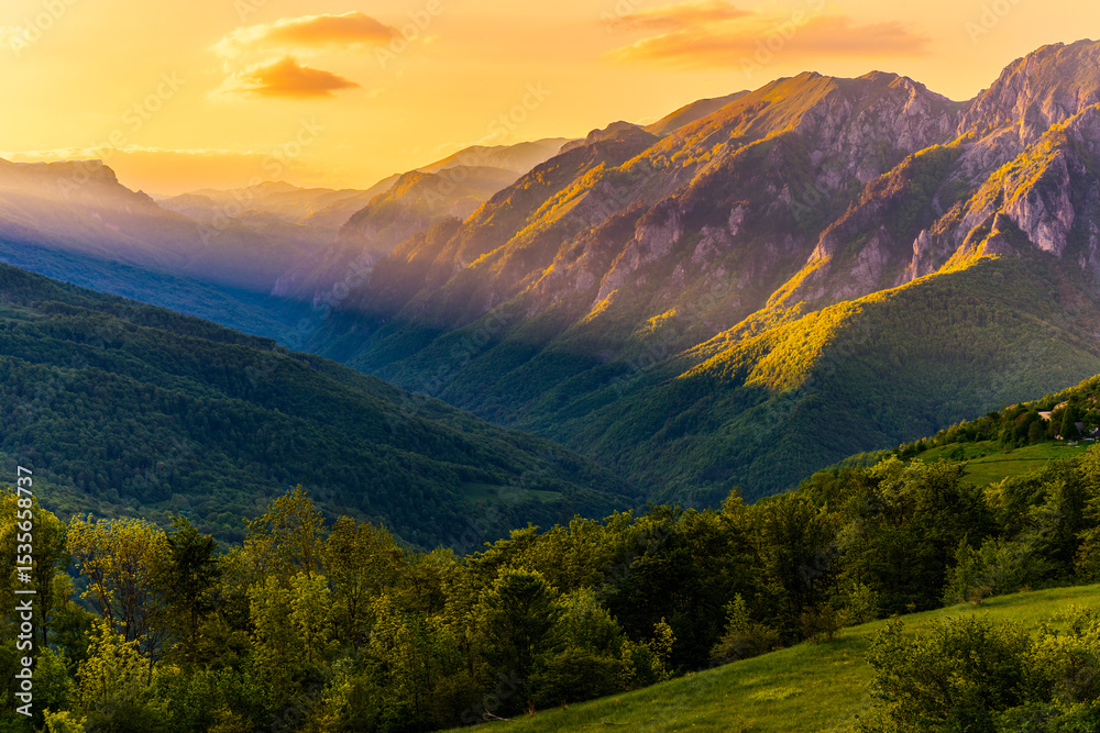 Fototapeta premium Sutjeska National Park in Bosnia and Herzegovina. Sunset in the mountains of Bosnia in the area of Prijevor and Veliki Maglic. Illuminated mountain massif on the border with Montenegro