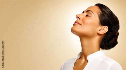 Calm woman with closed eyes and relaxed expression enjoying peaceful moment