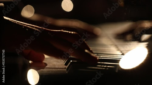 a top-down view of a pianist playing under a spotlight, and an intimate, silhouetted close-up of hands on the keys with beautiful bokeh.