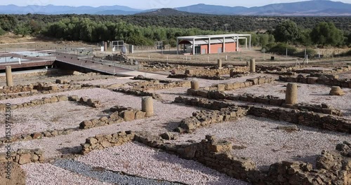 Roman ruins of Caparra with view of archaeological remains near the arch.