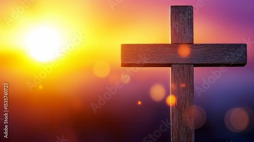 Sunrise backdrop highlights a wooden cross symbolizing hope and faith on a serene morning at a quiet outdoor setting