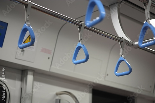 Closeup of Blue Handgrips Inside Modern Metro Train in Vietnam