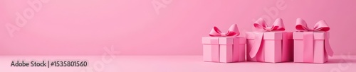 Three pink boxes with bows on a pink background, surprises, celebration, presents