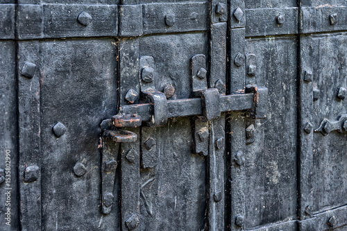 Antique iron door in the old brick wall.