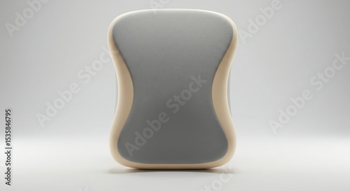 A sleek, modern gray sponge with a curved design. The sponge has a smooth surface and a light-colored border, suitable for cleaning or personal care.