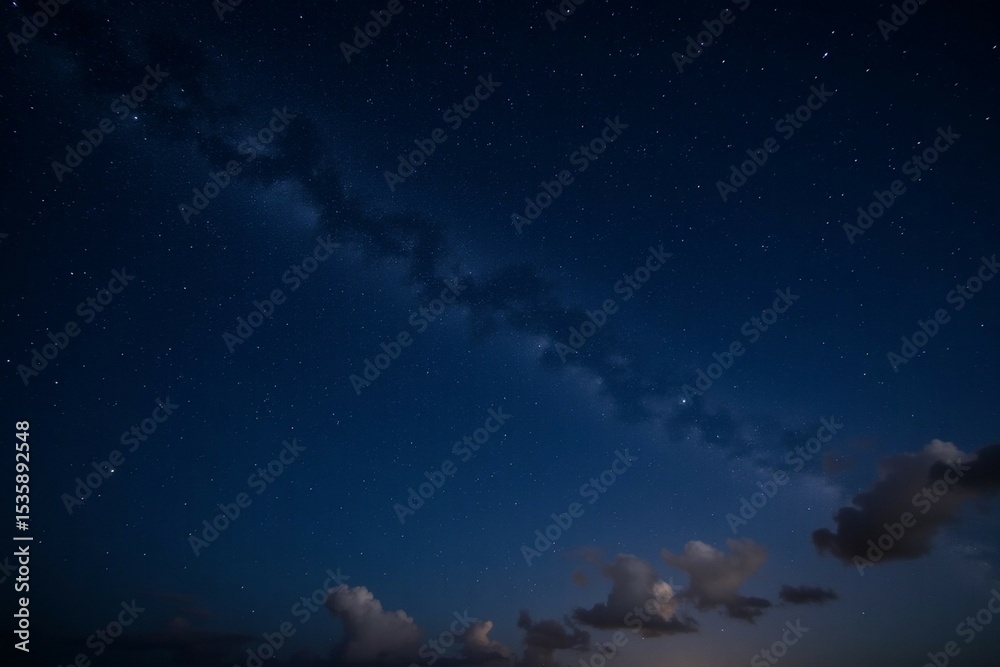 Naklejka premium Starry night sky with shimmering stars and cosmic dust creating a beautiful celestial scene for space enthusiasts and dreamers, cosmic beauty concept 