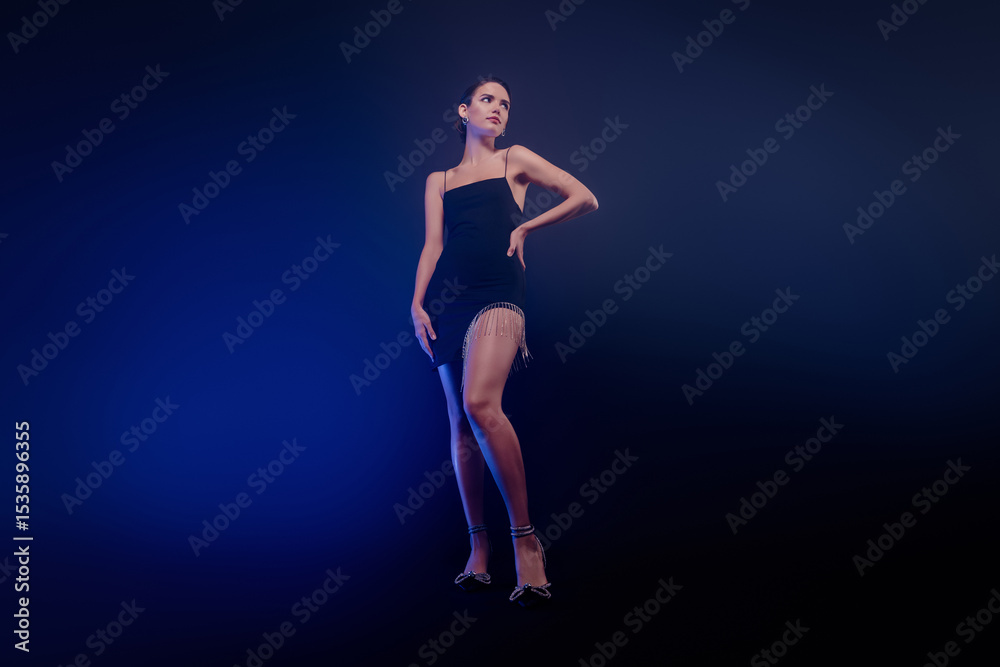 Fototapeta premium Full length photo of dreamy classy lady wear black dress dancing erotic moves isolated blue color background