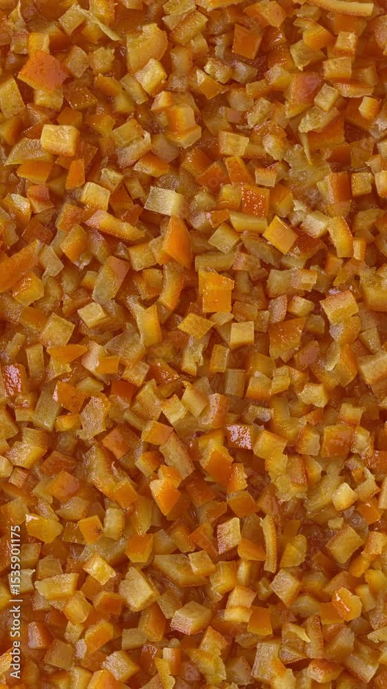 Homemade candied orange peel background texture. Flat lay, table spin, vertical video. Homemade candied orange peel background texture. Flat lay, table spin, vertical video.