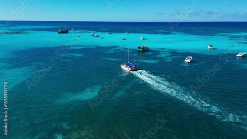 Aerial view of speedboat on the turquoise ocean