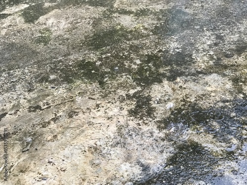 rain on the street,Raindrops on the concrete floor,Raindrops that hit the water surface.Raindrops splashing on a cement concrete floor