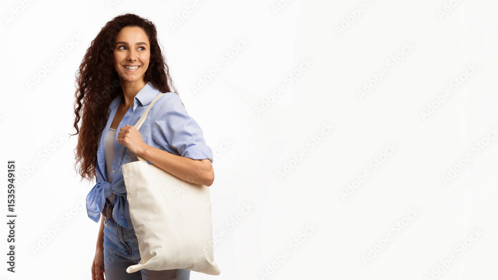 No Plastic. Happy Woman Carrying Flax Eco Bag Posing Looking Aside On White Studio Background. Eco-Friendly Shopping, No Plastic Life, Ecology Concept. Panorama With Copy Space No Plastic. Happy Woman Carrying Flax Eco Bag Posing Looking Aside On White Studio Background. Eco-Friendly Shopping, No Plastic Life, Ecology Concept. Panorama With Copy Space