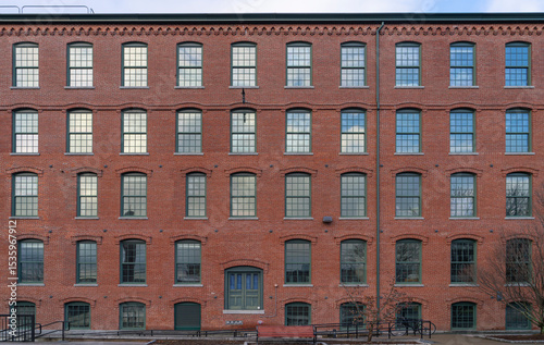facade view of old factory building with red brick wall