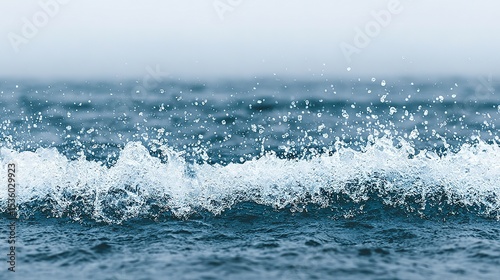 Ocean waves splashing and creating white foam.
