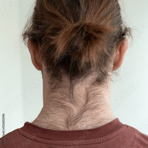 Close-up of hairy male back and neck from behind