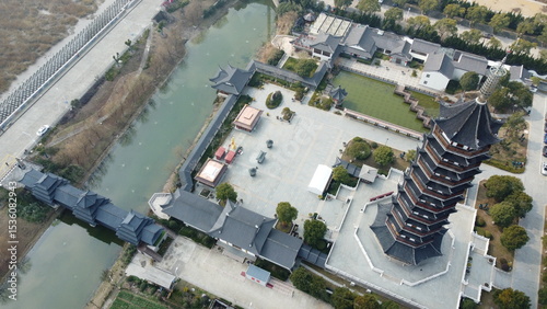 Fotografija Drone footage of Jinshan District in Shanghai, China, featuring traditional farmland, a Chinese pagoda, and classic architecture