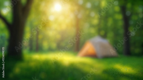 camping and defocused bokeh and blur background of garden green tree; summer vacation; travel