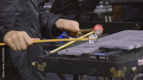Musician hands percussionist playing glockenspiel orchestral bells xylophone concert