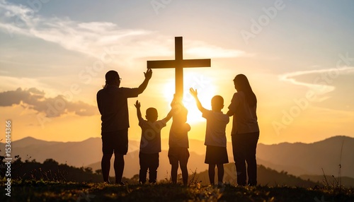 Family praying at sunset (1)