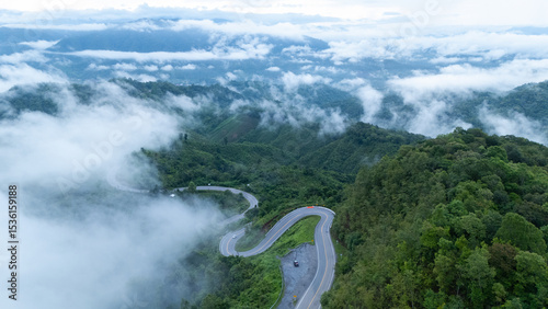 Aerial view of the folding cloth bend, Nan Province, a beautiful road that curves along the mountain, full of trees, fog and clouds, a tourist attraction in Nan.
