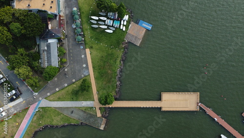 Drone views of Dongqian Lake, farmland, old town rooftops, and mountain sunset near Ningbo, China. Scenic countryside and waterfront scenes from above.