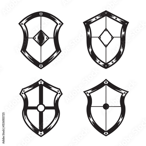 Set of four intricate shield silhouettes in black and white featuring detailed design elements and decorative styles
