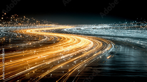 Abstract gold and blue light trails swirling in dark space, creating a dynamic, futuristic, and energetic visual effect.