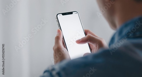 Person Using Smartphone With Blank White Screen