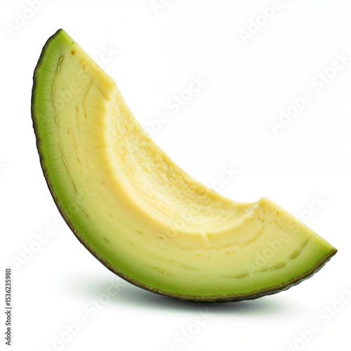 Fresh avocado slice showcases its vibrant green and yellow colors on white backdrop