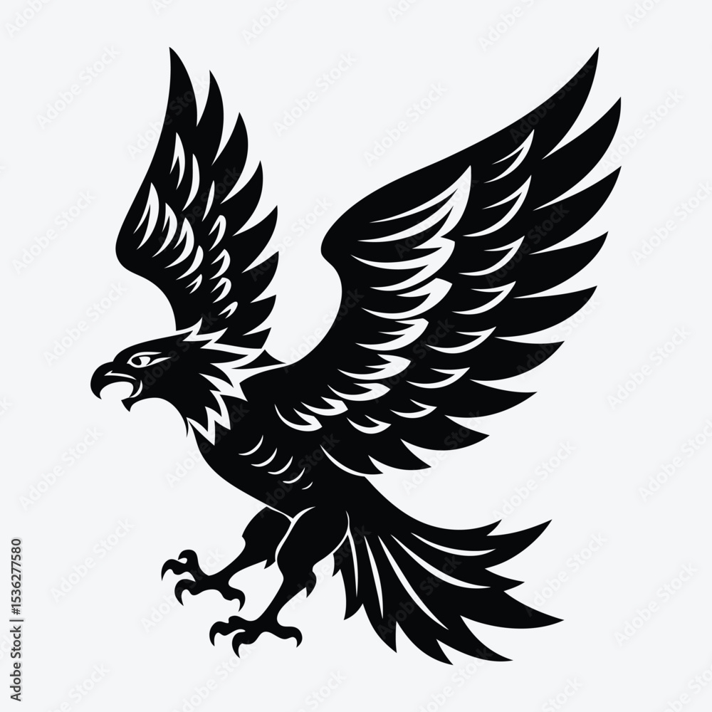 Obraz premium A black silhouette of an eagle with spread wings flying