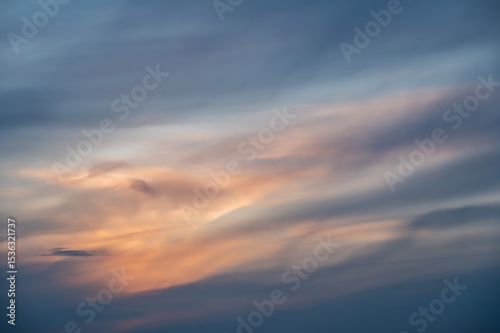 Sunset sky with soft clouds as background.