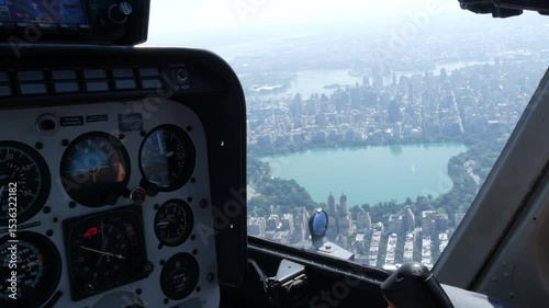 New York City helicopter cabin flight, heli cockpit flying over Manhattan, United States. Extreme tourism, travel USA. Camera shaking. Central Park and West side residential buildings. Control panel.