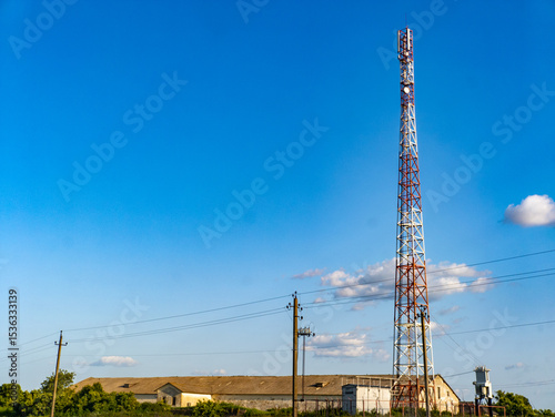 A cell phone tower in the middle of a field