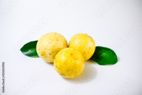 lemon with slice and green leaves isolated on white background. clipping path
