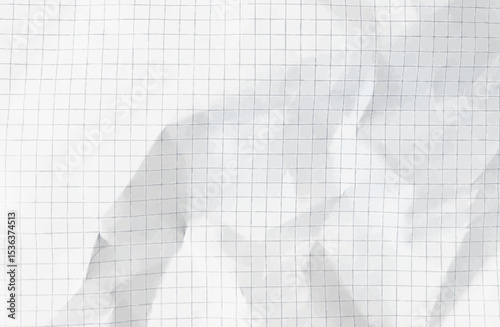Crumpled white paper sheet with check grid lines overlay - wrinkled notebook page with mathematical graph squares, folded texture on checkered surface for school homework or office calculations.