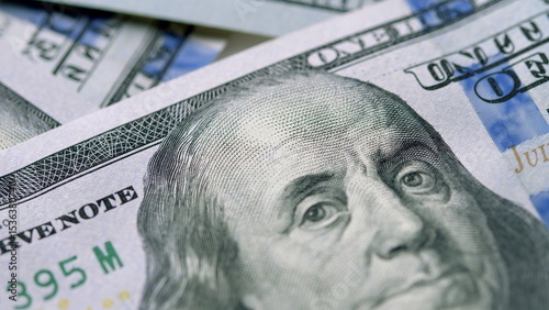 A CloseUp Image of a Detailed Hundred Dollar Bill Showcasing Its Various Unique Features