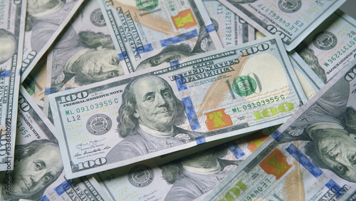 A Visual of Stacked Hundred Dollar Bills Representing Wealth and Finance Today