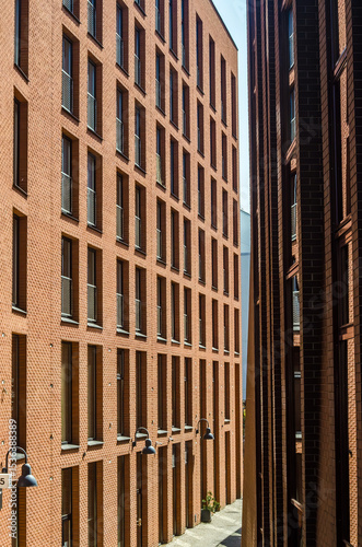Modern brick apartment buildings with geometric windows in urban cityscape. High quality photo photo