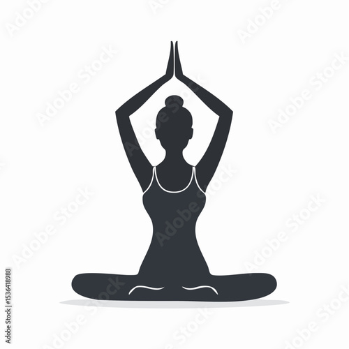 Silhouette of a woman in a lotus position, hands raised in prayer, practicing yoga.
