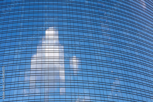 Close up of a glass palace at the modern district of Porta Nuova, Milan, Italy photo