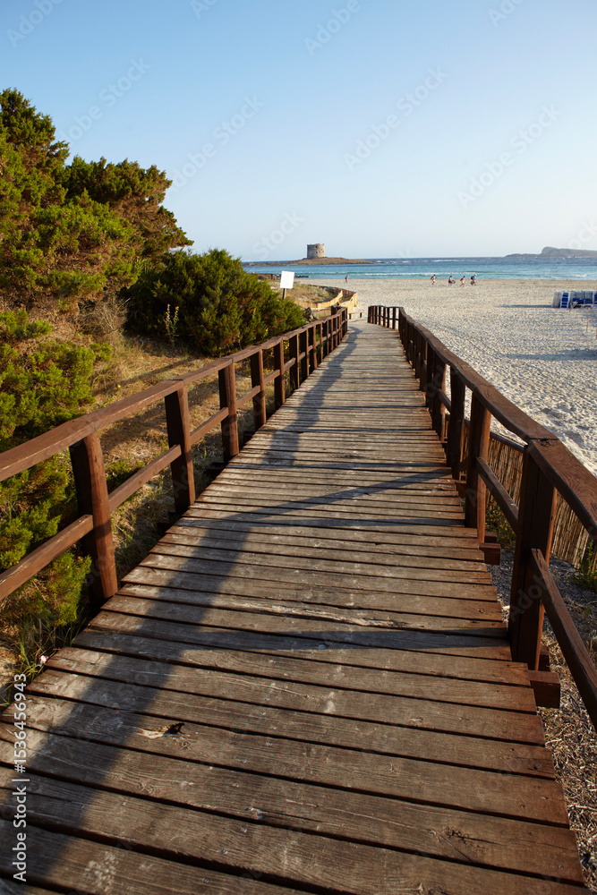 Fototapeta premium Footbridge to the beach of La Pelosa in Stintino, Sardinia, Italy